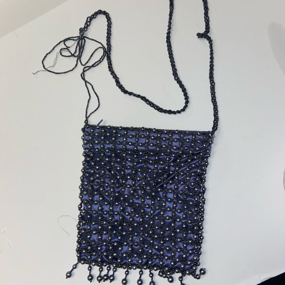Pearl sequin bag one strap is loose